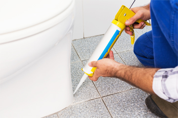 Bathroom floor being treated for waterproofing