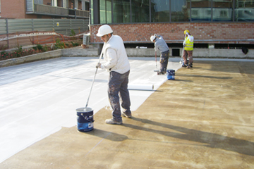 Crew coating a large terrace